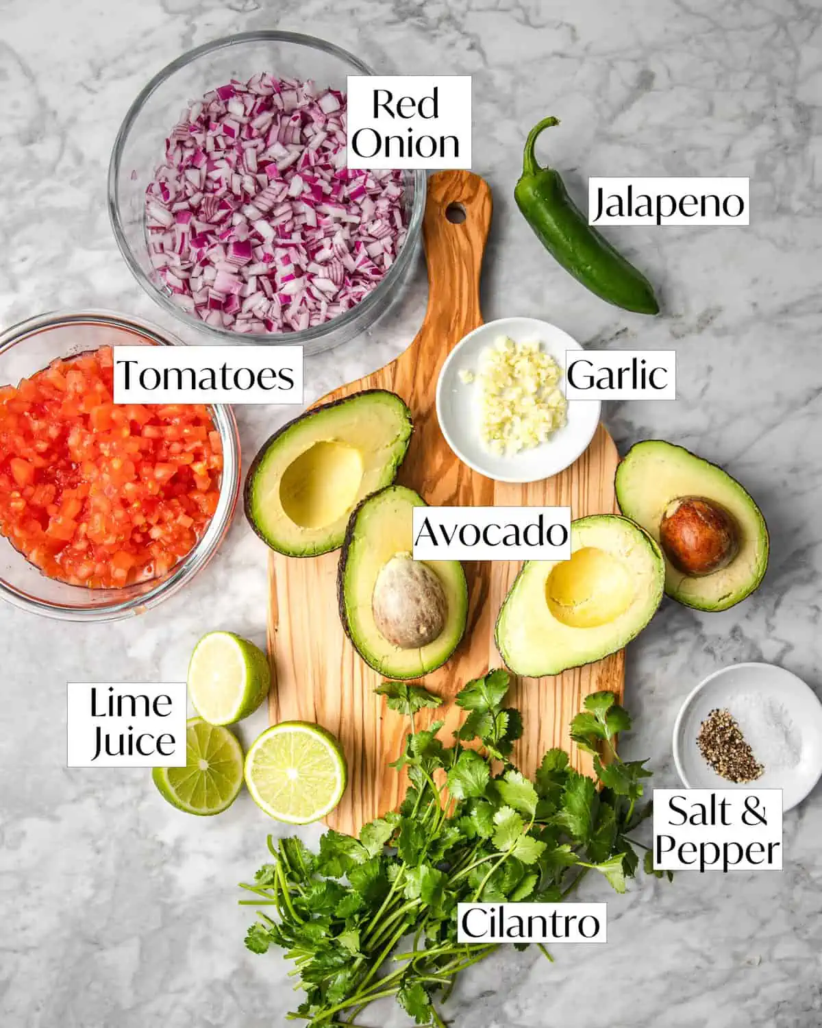 ingredients for pico de gallo with avocado laying on counter. 