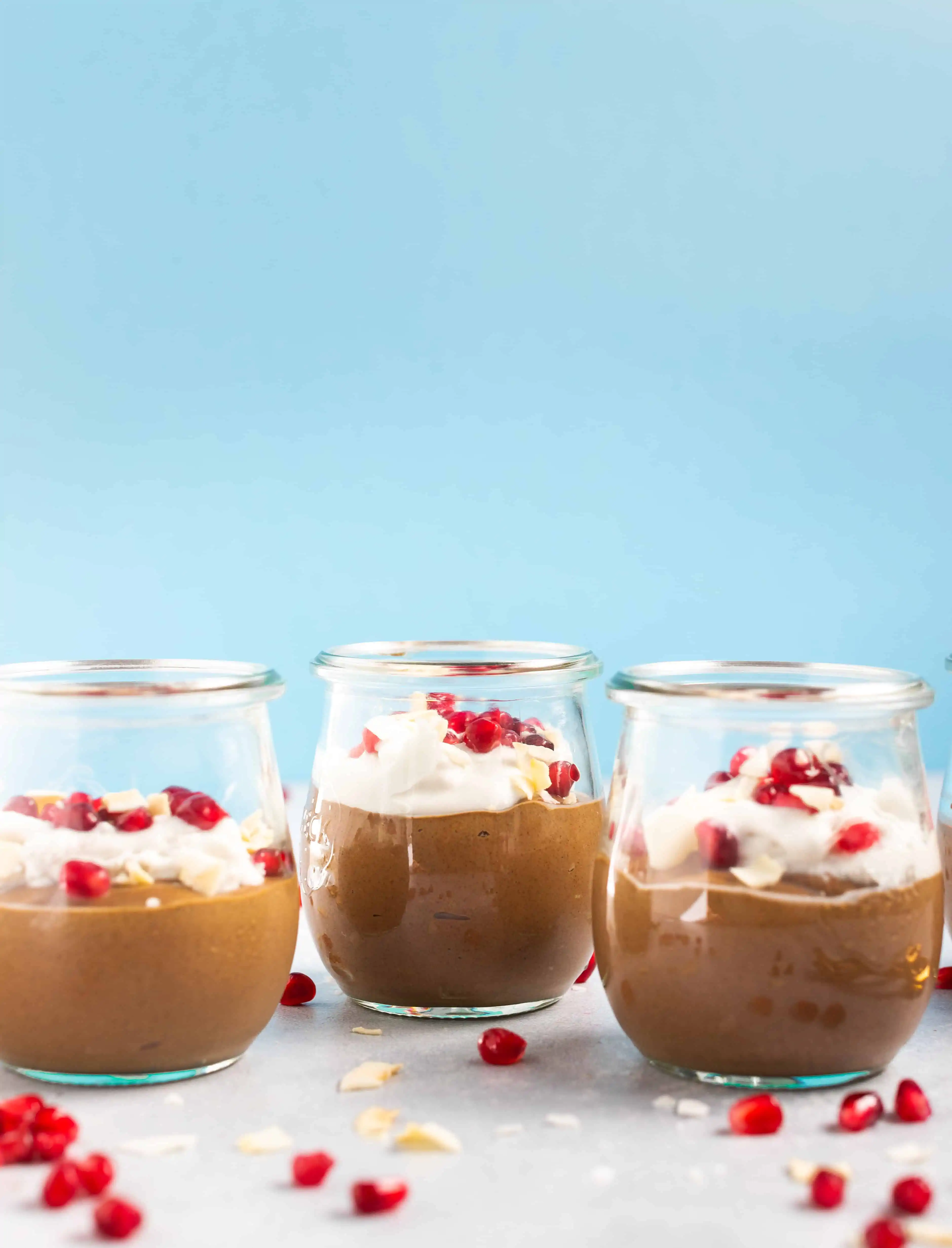 Chocolate Chia Mousse with pomegranates and coconut flakes