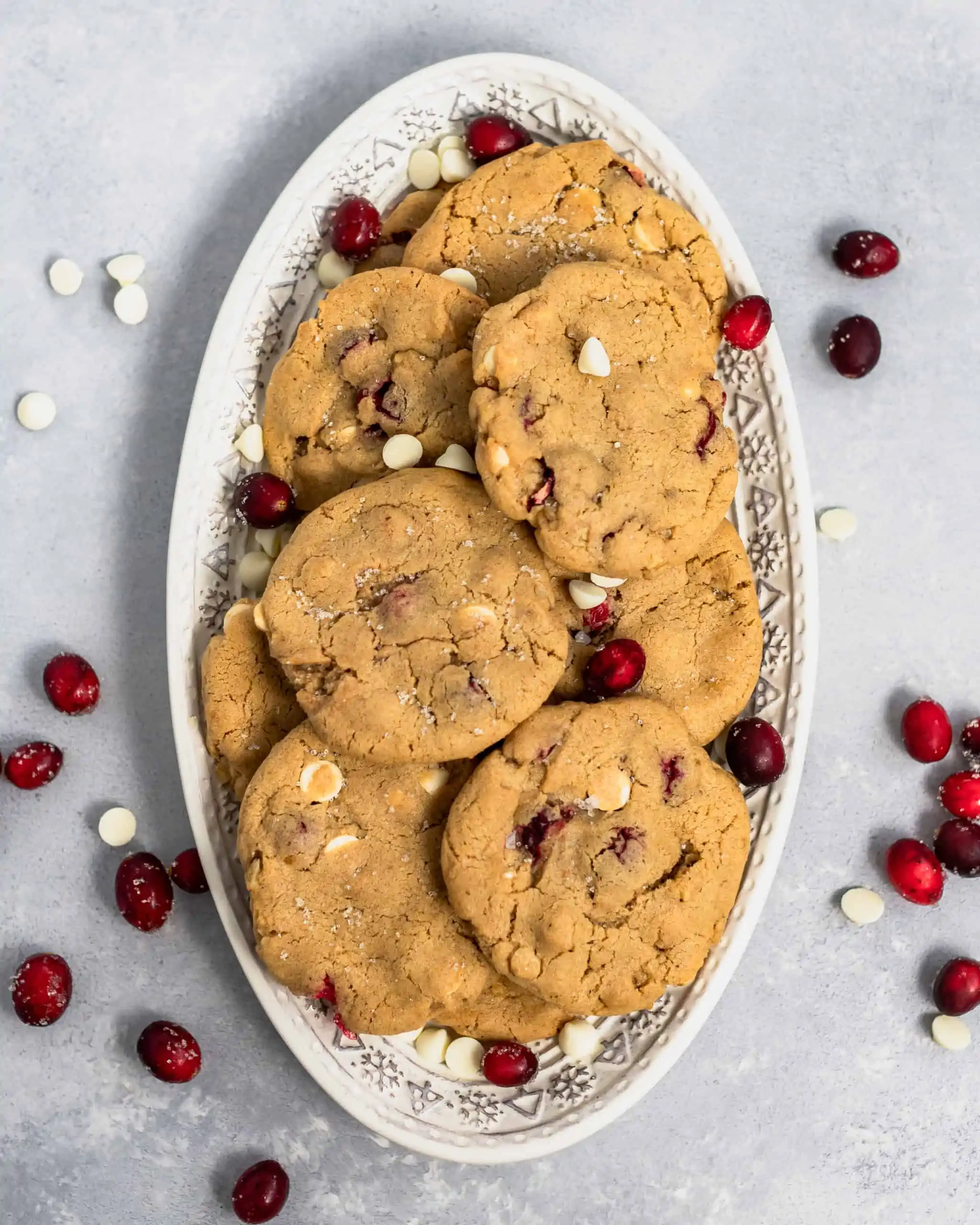 white chocolate cranberry walnut cookies on a plate.