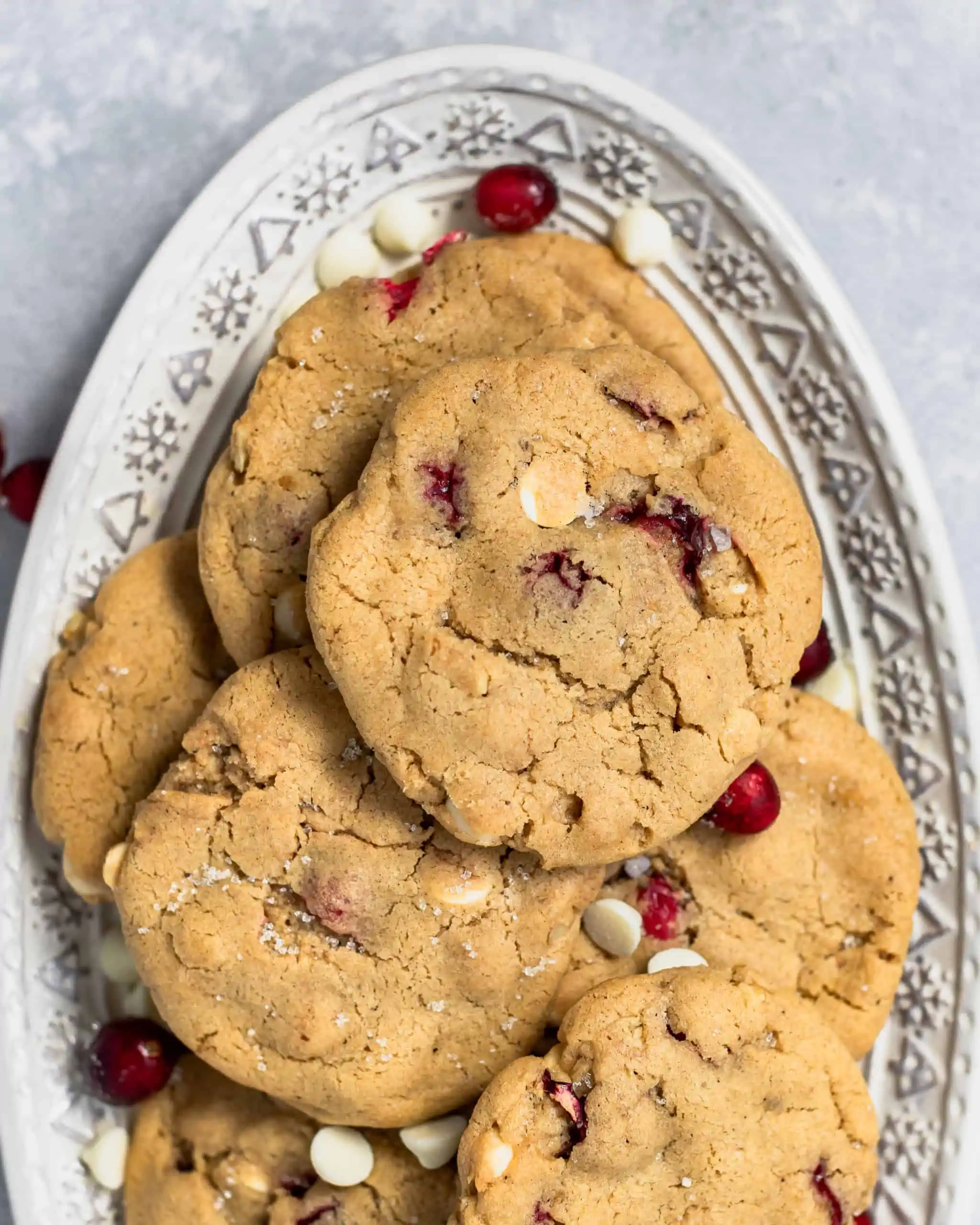 cookies with cranberries, white chocolate and walnuts on a plate.