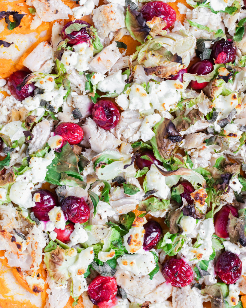 baked pizza with turkey, cranberries, brussel sprouts, and goat cheese. 