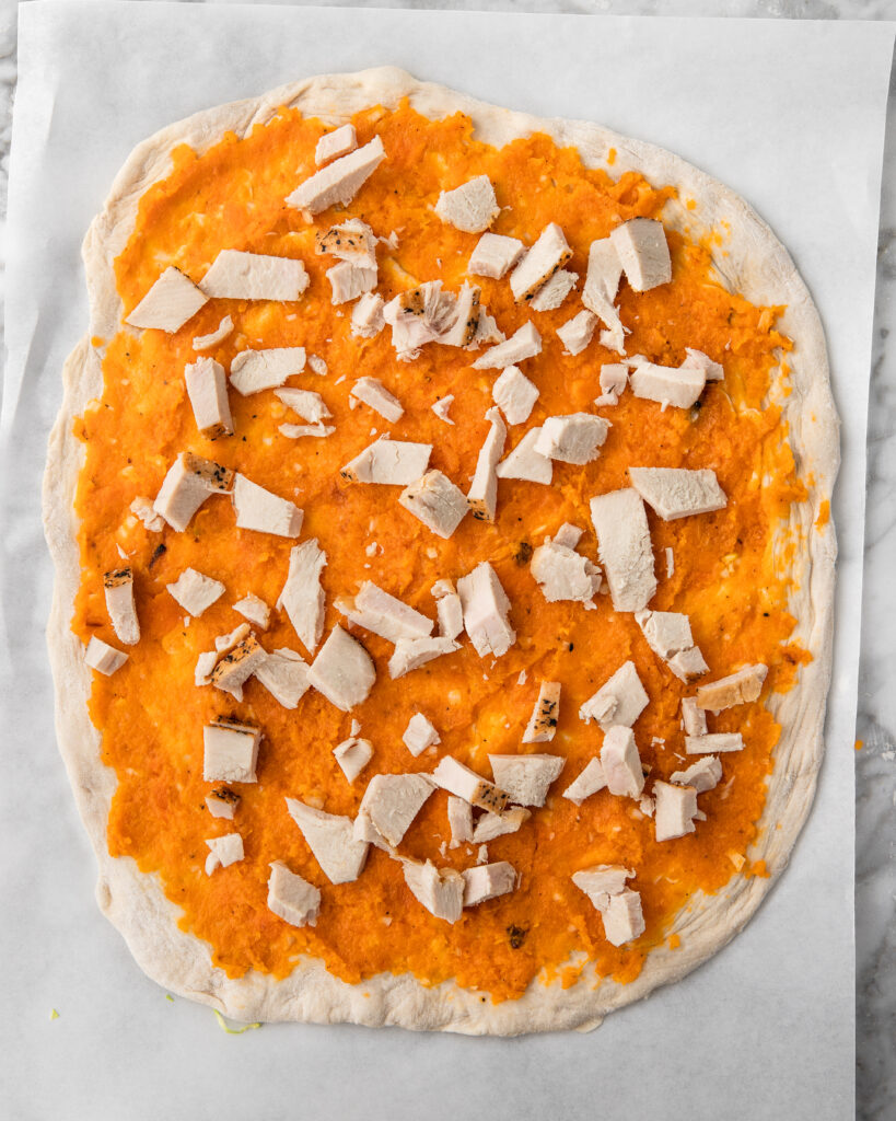 leftover thanksgiving turkey added to a pizza with sweet potato.