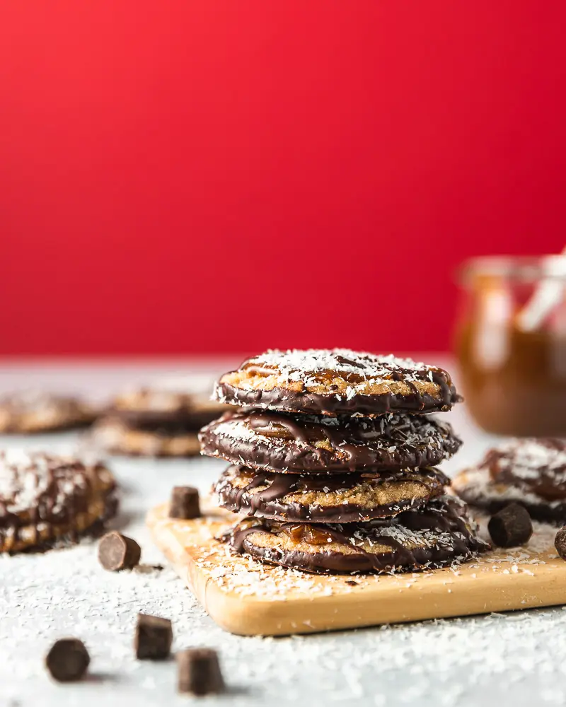 shortbread cookies with caramel, coconut flakes, and chocolate