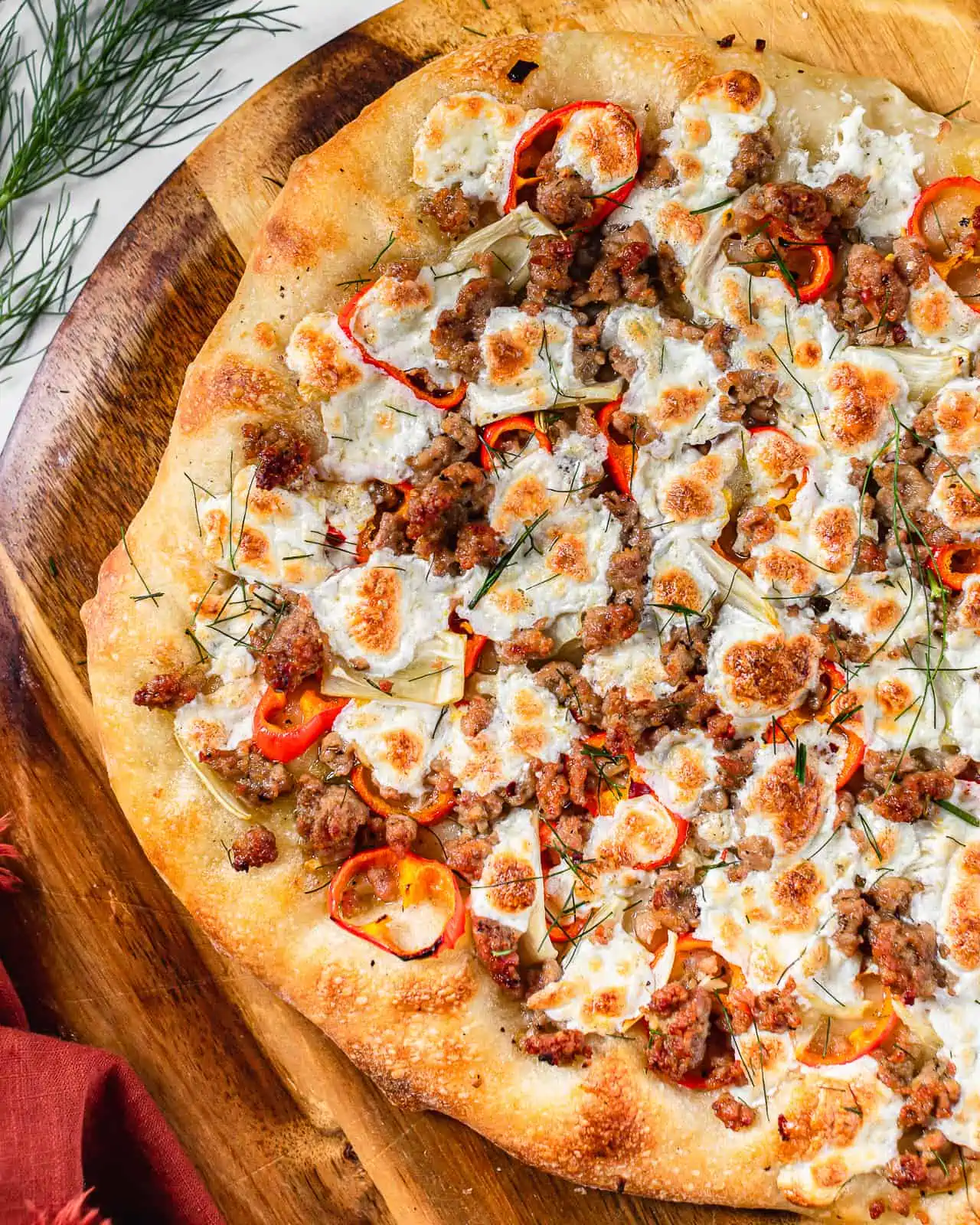 fennel and sausage pizza with mozzarella cheese. 