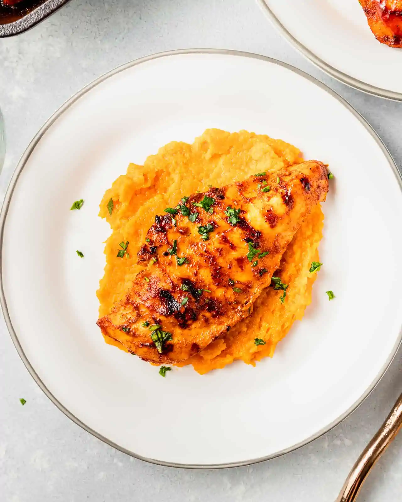 bbq chicken served with mashed sweet potatoes 