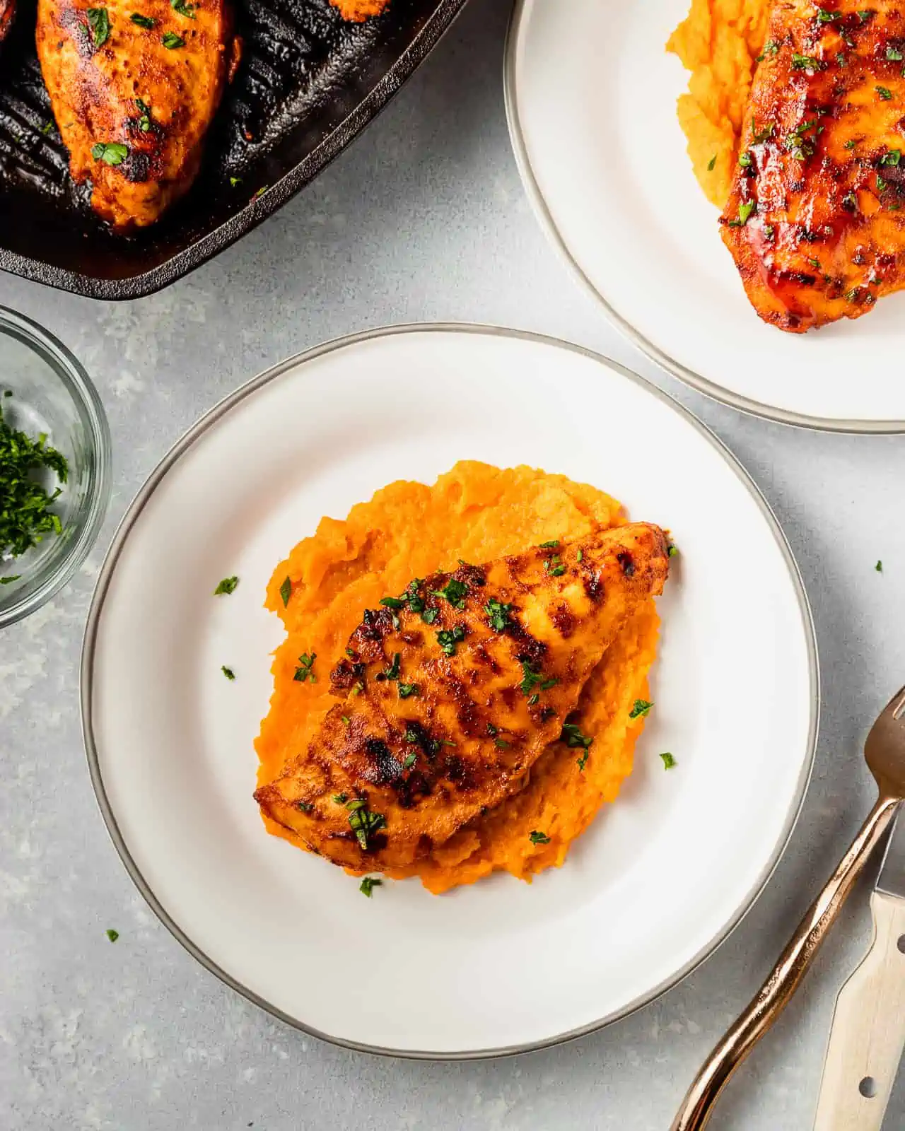 barbecue chicken served with mashed sweet potatoes 