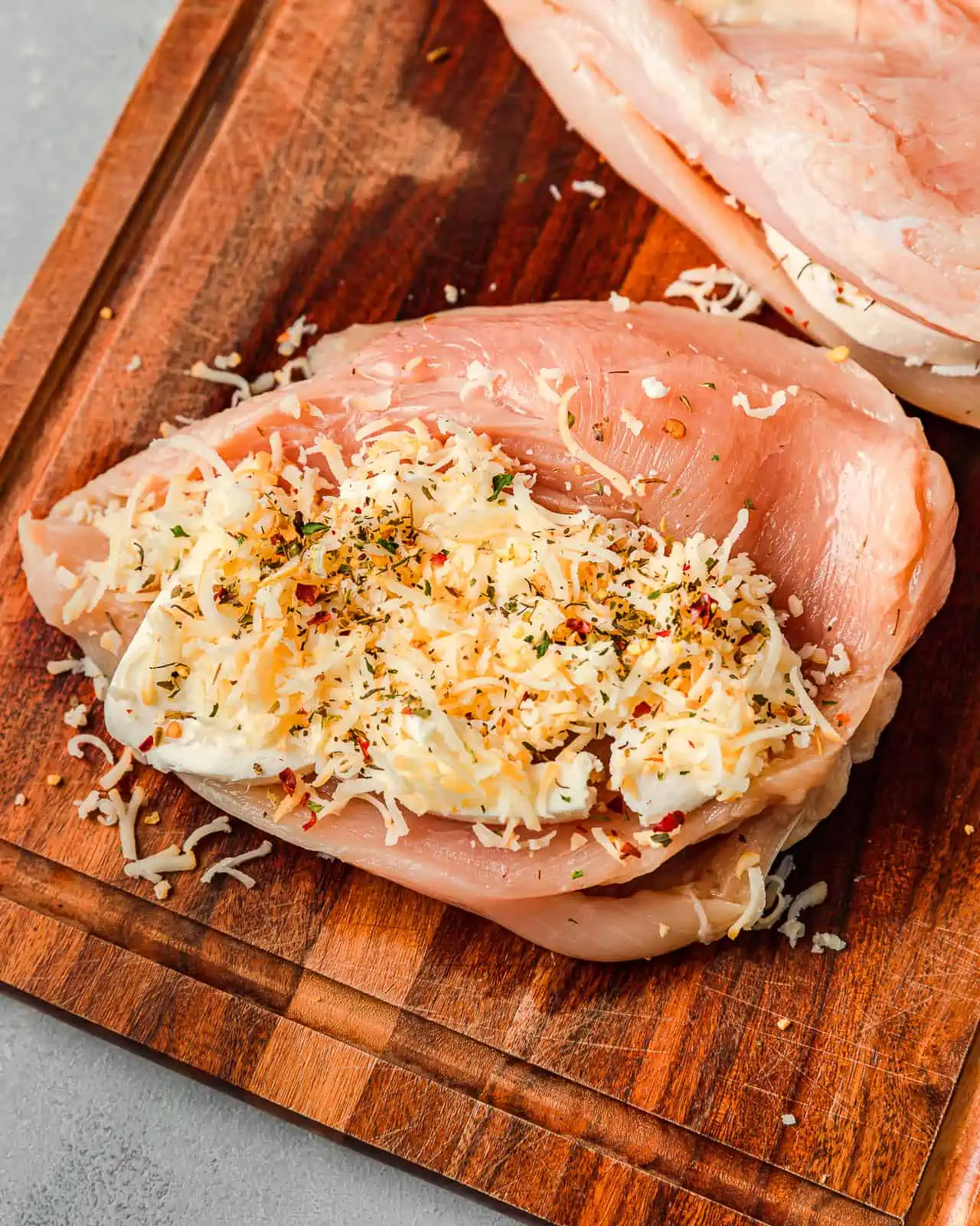Raw Chicken stuffed with Mozzarella and seasoned with Spiceology's Pizza Pie Spice Blend