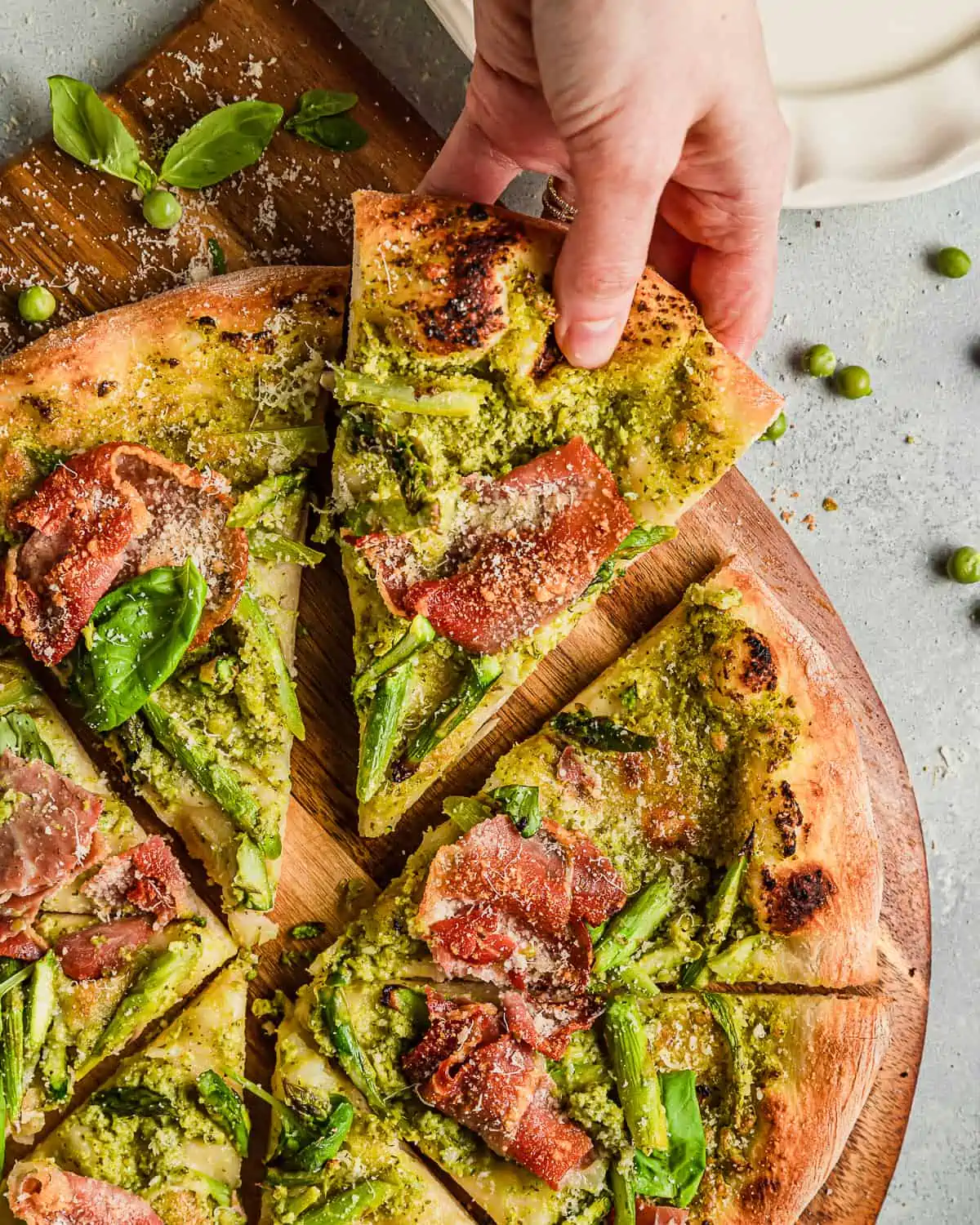 A slice of Asparagus Pizza with Prosciutto 