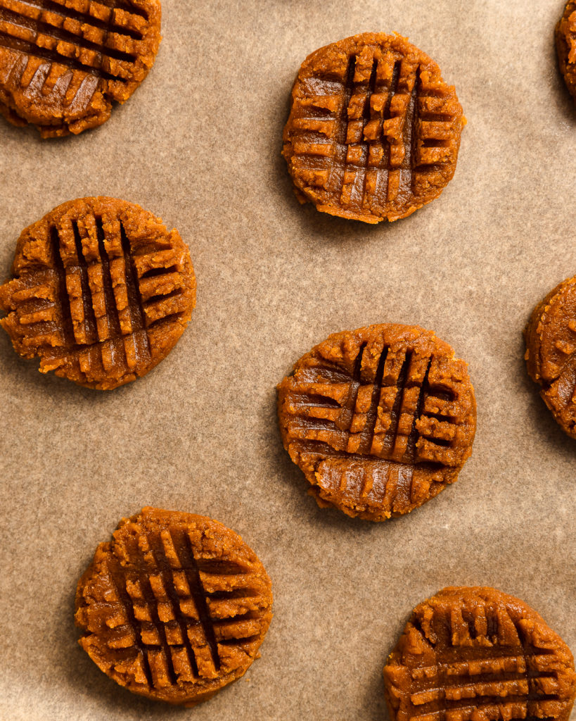 Peanut Butter Cookies laying on parchment paper