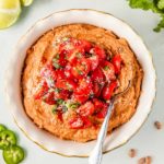 refried pinto beans with tomato salsa on top