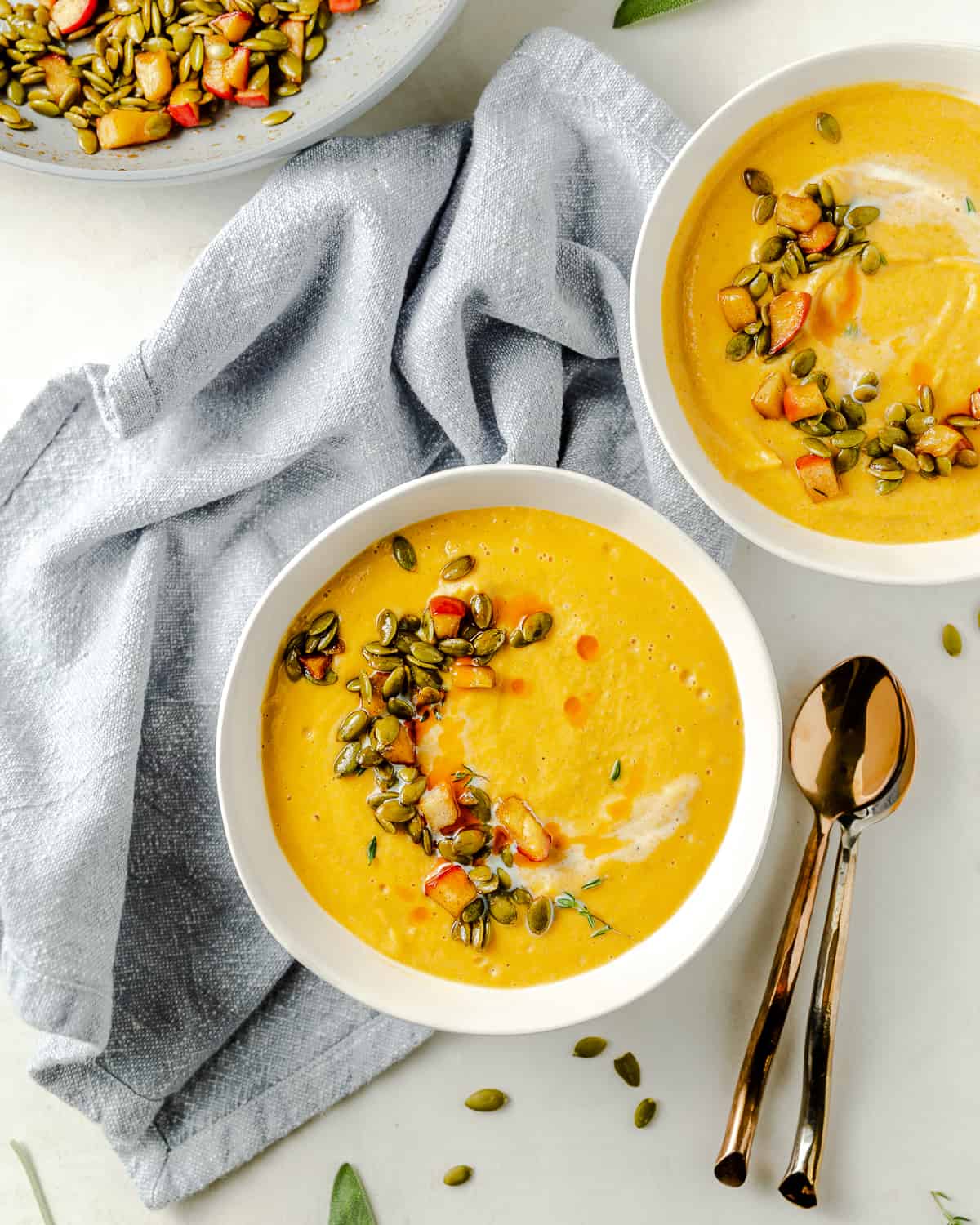 Two bowls of butternut squash soup.