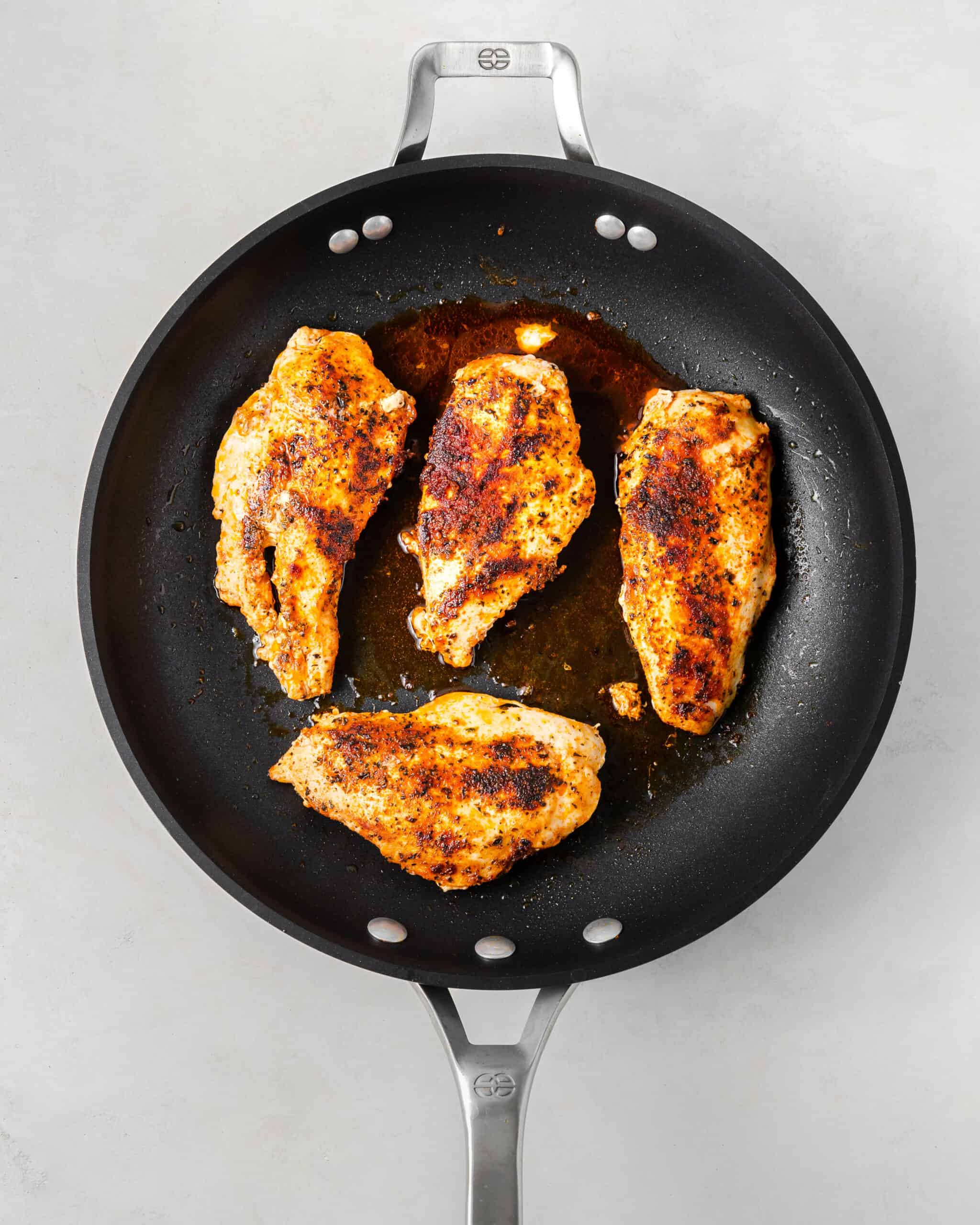 Cooked Chicken in a pan.