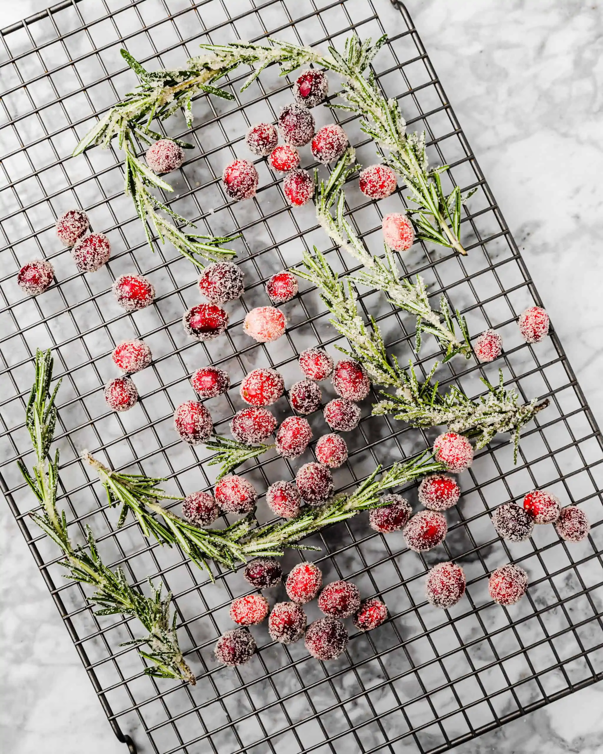 drying sugared cranberries and rosemary.