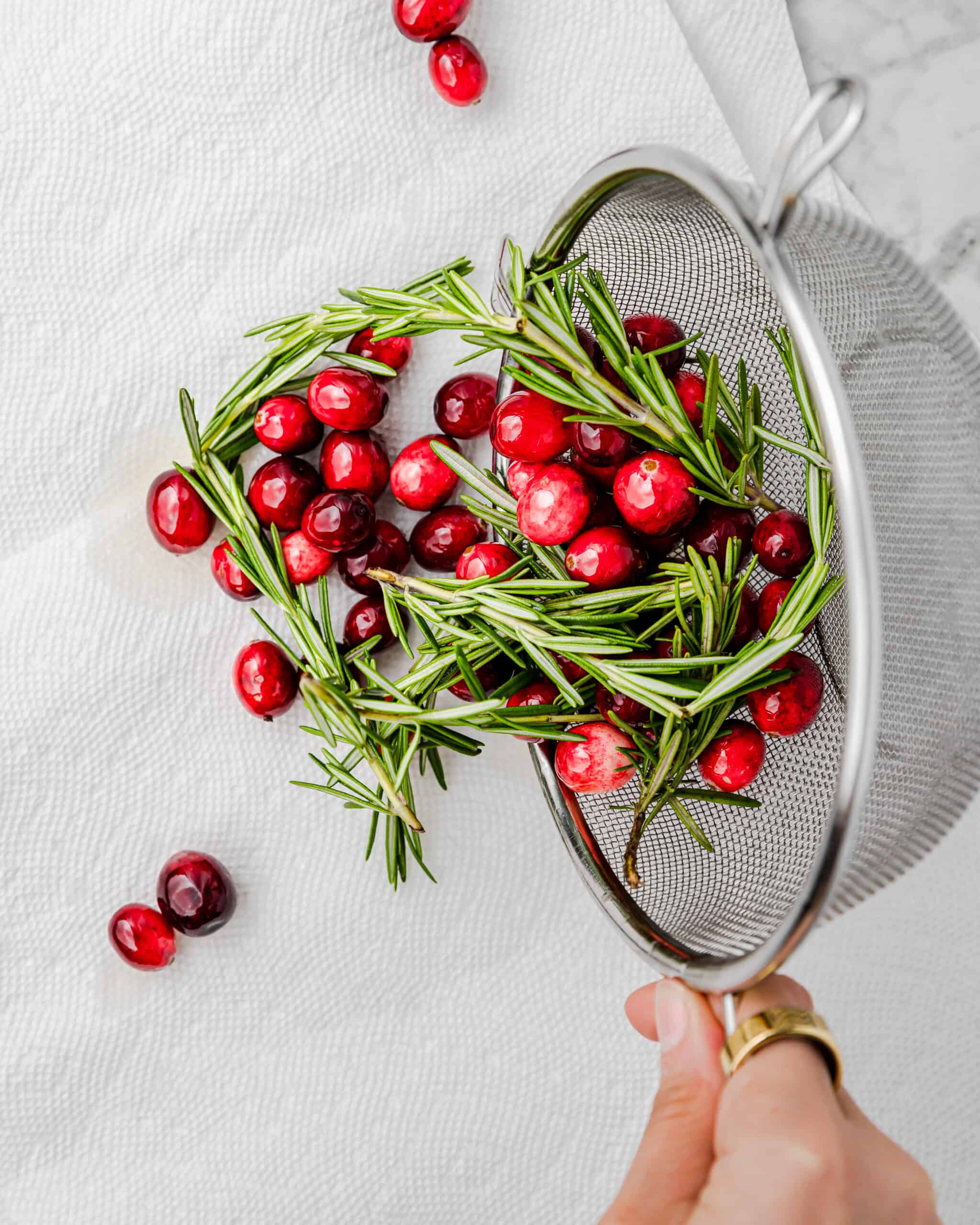 drying sugar coated cranberries and rosemary.