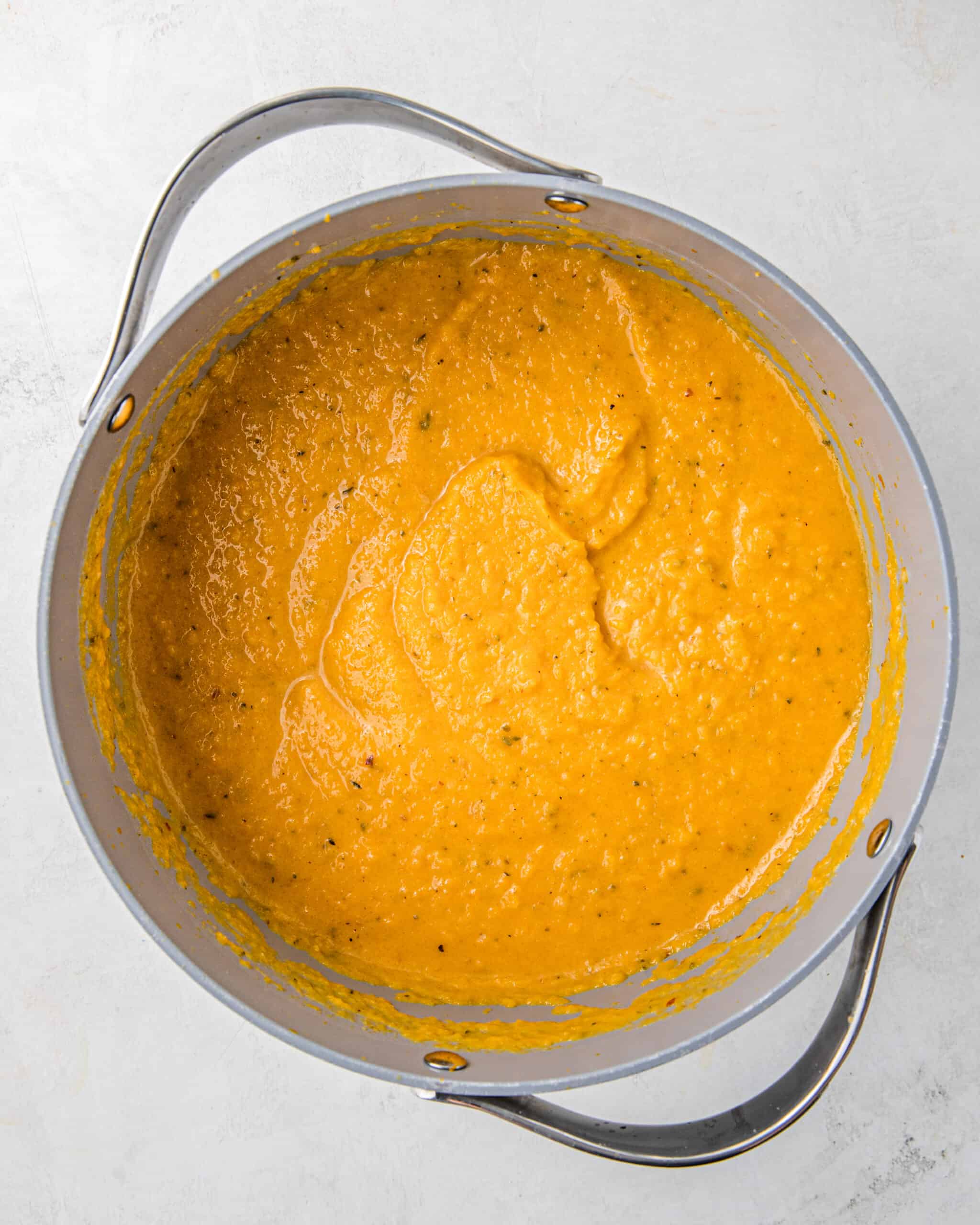 pureed roasted butternut squash soup in a pot.