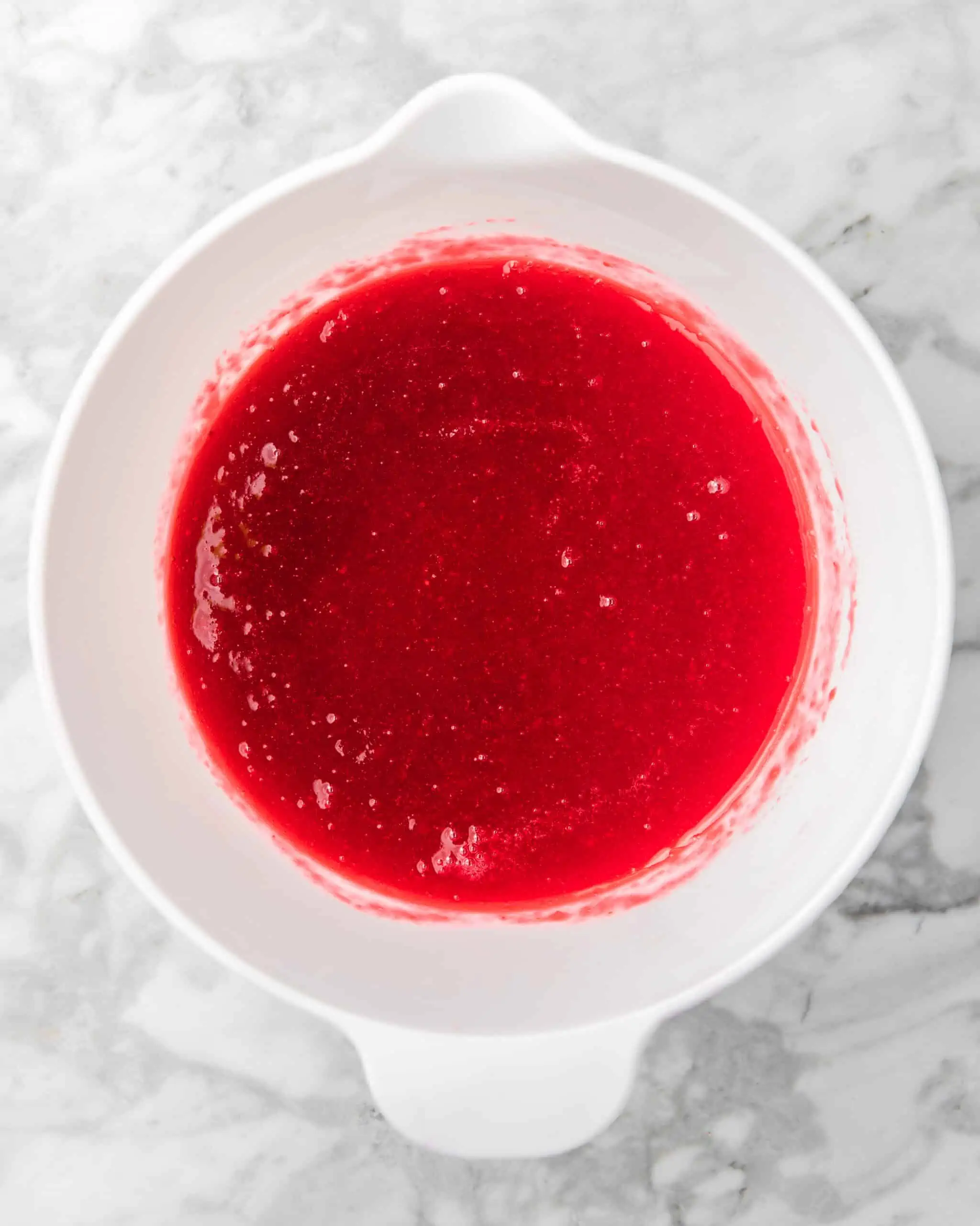 a bowl of cranberry simple syrup.
