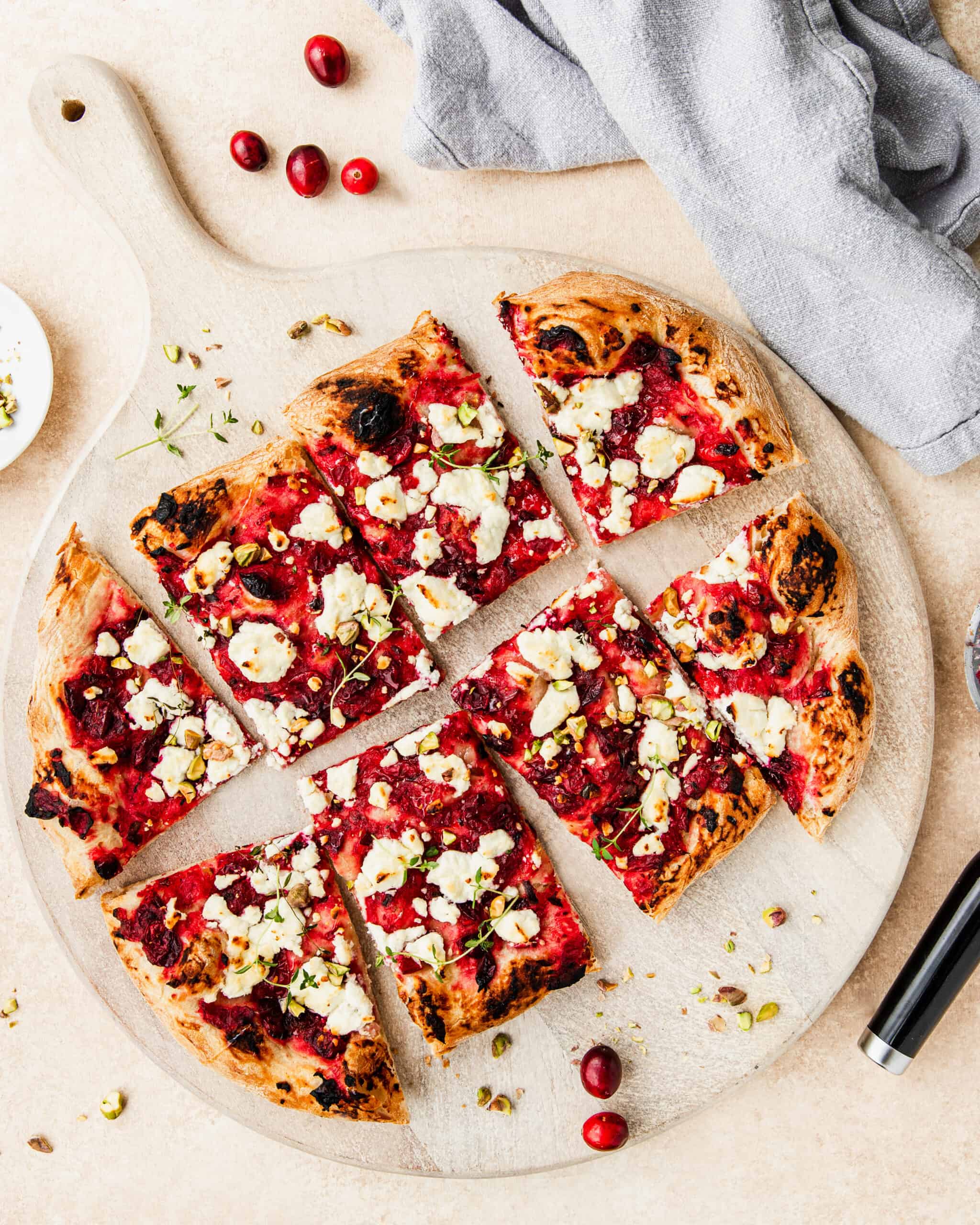 cranberry pizza with goat cheese and pistachios. 