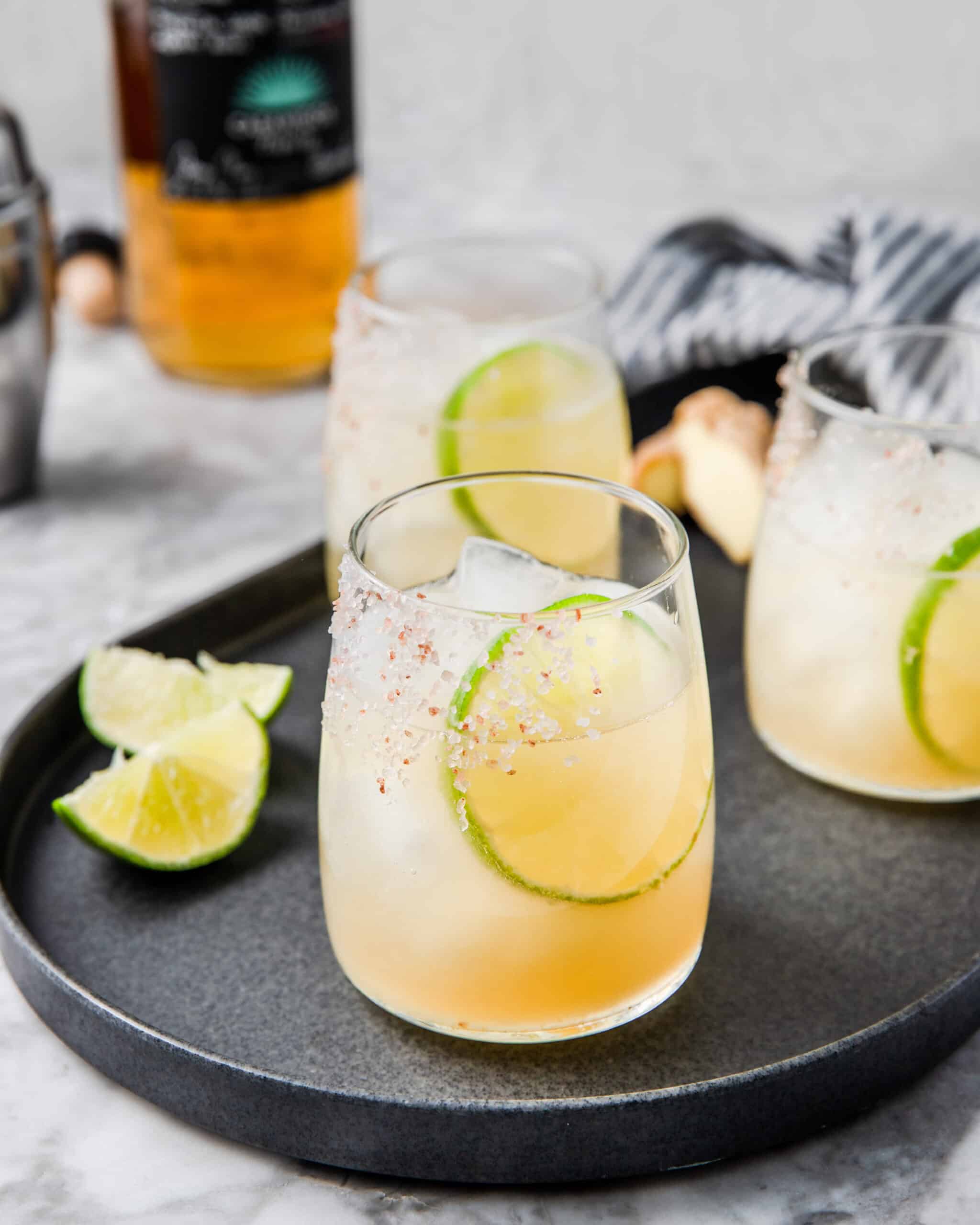 2 glasses of ginger margaritas with lime.