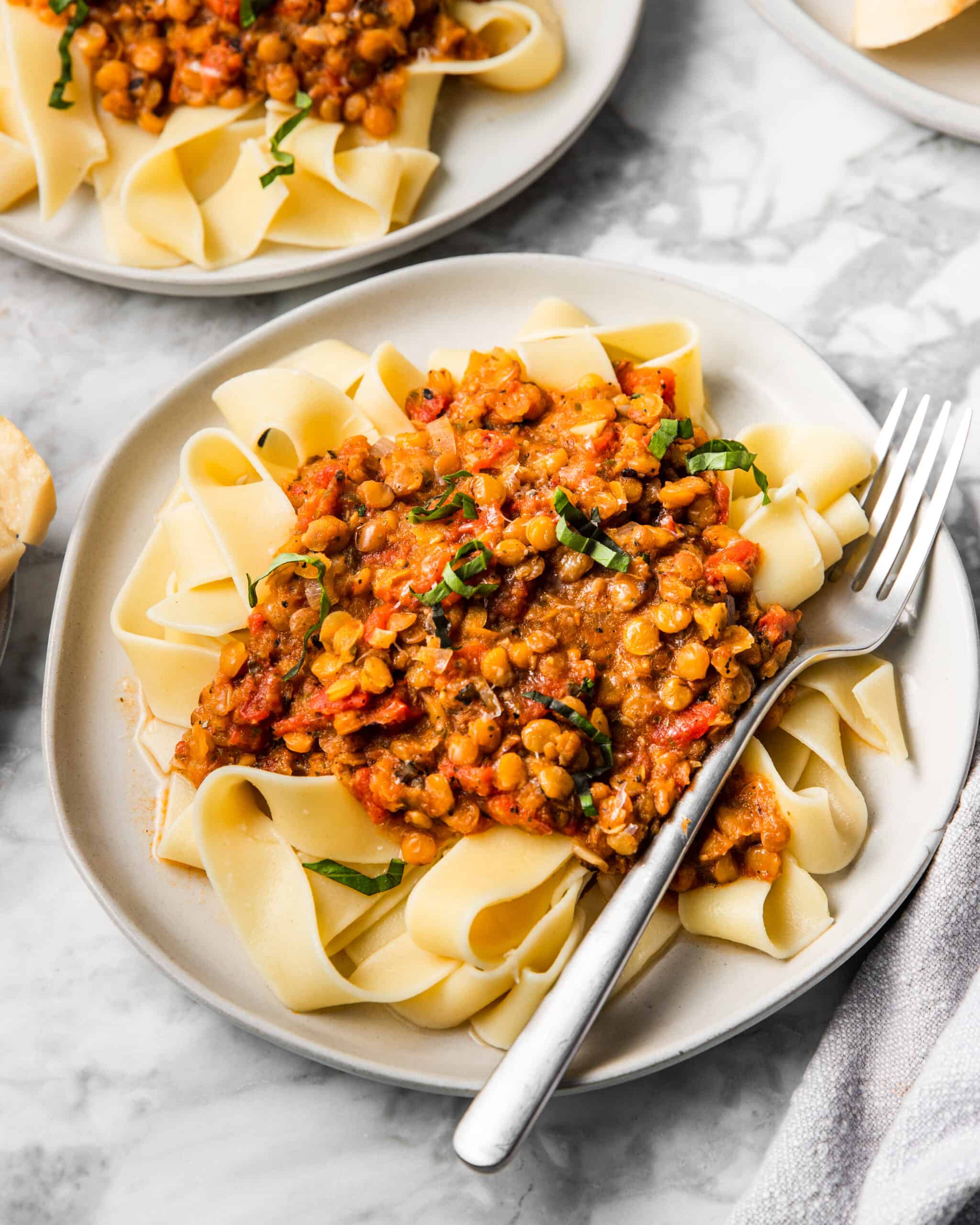 a plate of lentil bolognese and basil