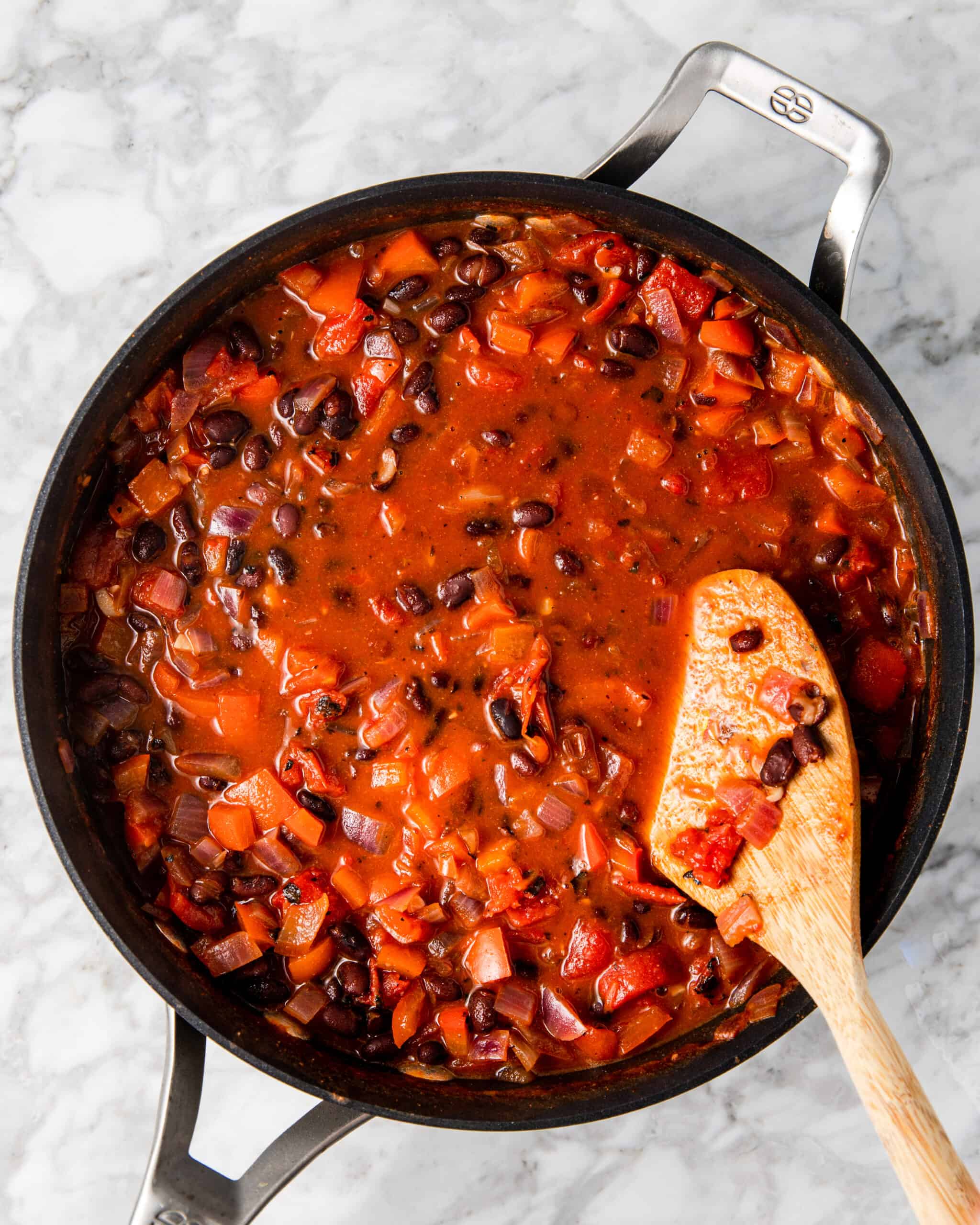 Black bean stew in a sauce pan.
