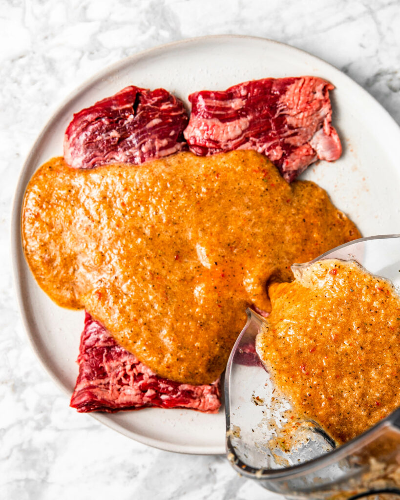marinating steak with chipotle sauce.