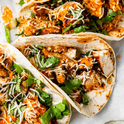 tacos with ancho flavored chicken and salsa.