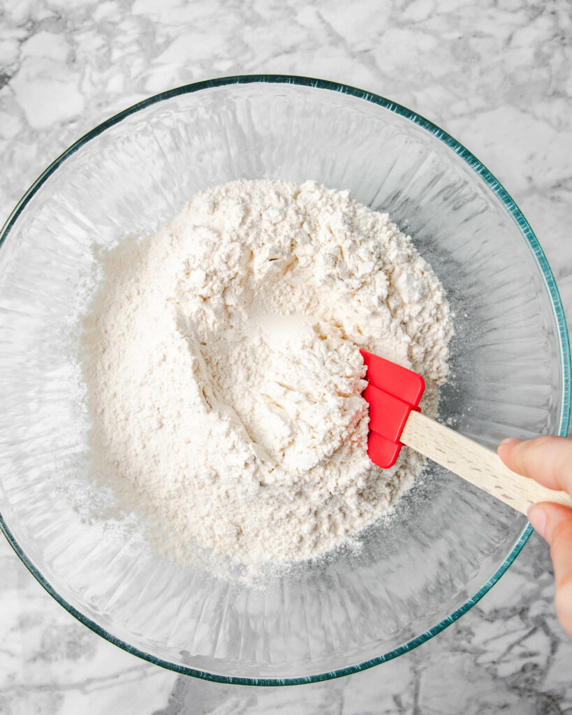 tossing flour with salt in a bowl.