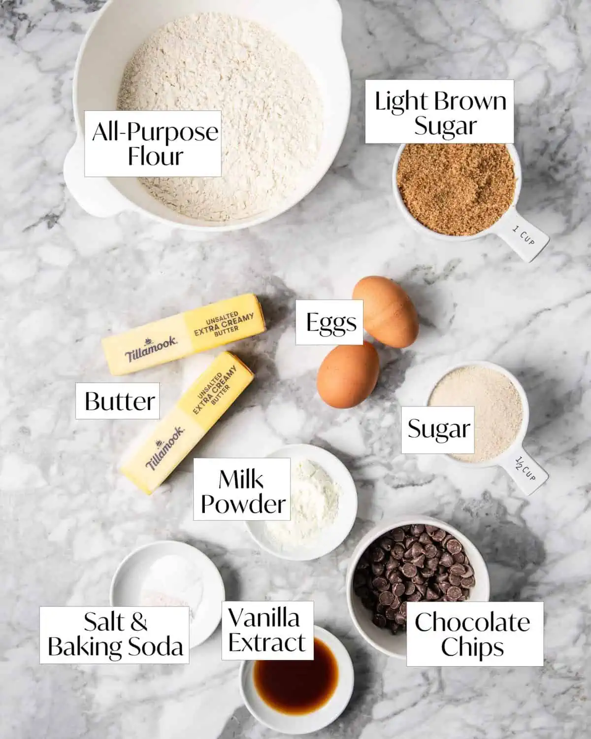 chocolate chip cookie ingredients on a marble counter. 