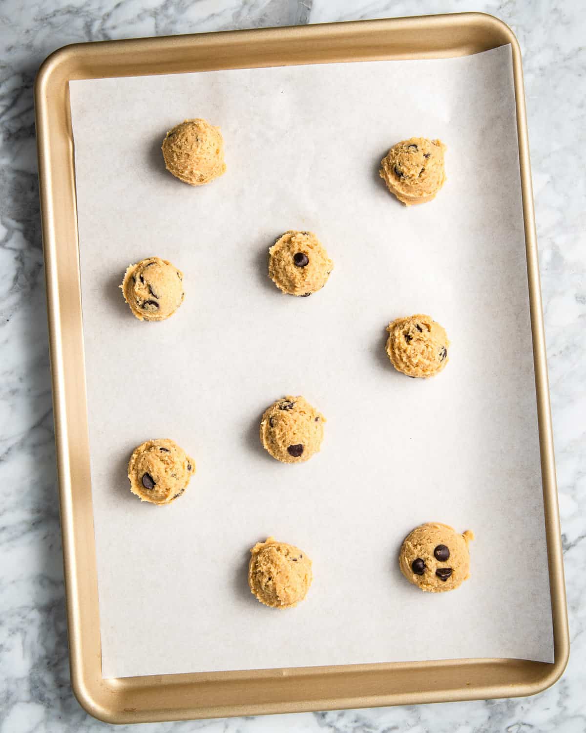 cookie dough on a baking sheet lined with parchment paper. 